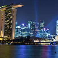 Singapore skyline at night, with Marina Bay Sands in foreground