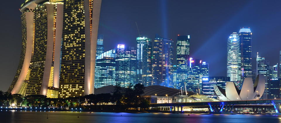 Singapore skyline at night, with Marina Bay Sands in foreground